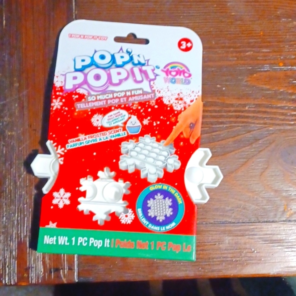 This a brand new POP,N POP IT it's the shape of a snow flake